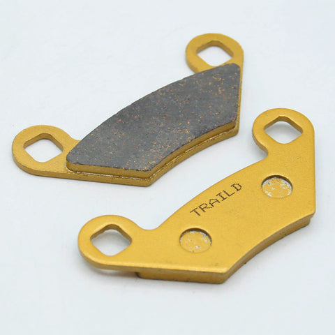 Ceramic brake pads for Polaris Sportsman ATV, two pieces; close-up view shows gold backing plates and dark friction material
