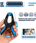 Heavy Duty 4 Inch Spring Clips 12 Pack Plastic Clamps With Steel Springs Built For Woodworking Backdrop Stands Pool Covers Photography And Crafts Built Tough For Strong Grip And Rust Resistant Performance shown in hand for scale