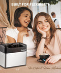 Automatic Portafilter Washer With Three Liter Tank Efficient Three Way Valve Rapid Drainage Fits 51 And 58 Millimeter Espresso Machines Stainless Steel Build on kitchen counter with two smiling women.