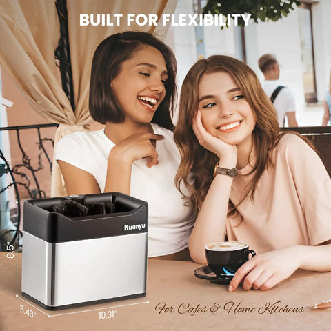 Automatic Portafilter Washer With Three Liter Tank Efficient Three Way Valve Rapid Drainage Fits 51 And 58 Millimeter Espresso Machines Stainless Steel Build on kitchen counter with two smiling women.