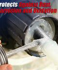 Premium White Lithium Grease Multi Purpose Lubricant applied to a metal thread, showcasing rust protection and lubrication.
