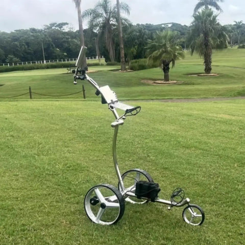 Heavy Duty Electric Golf Caddy on grass, 3 wheel folding frame, lightweight design for easy transport, ideal for hilly golf courses.