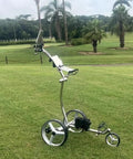 Smooth Operator Electric Golf Trolley With Quick Three Wheel Build And Easy Fold Design Offering Serious Hill Climbing Grip Whisper Quiet Motors That Handle Steep Angles Easily Lightweight Bag Carrier With Auto Lock Nine Speed Settings on a golf course.