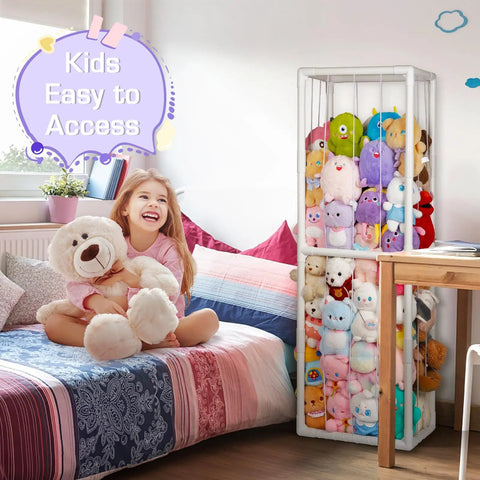 Stuffed Animal Storage Zoo Holder Space Saving Vertical PVC Toy Organizer With Elastic Net And Band For Playroom Bedroom Or Nursery Extra Large Capacity Cage White Durable Frame Great For Kids Toys And Tidy Rooms next to a bed