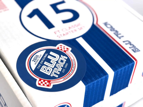 Close-up of packaging for Classic 15-Foot Race Track Starter Set with 2-Lane Wide Track, 2026 Upgrade, showing blue and white design.