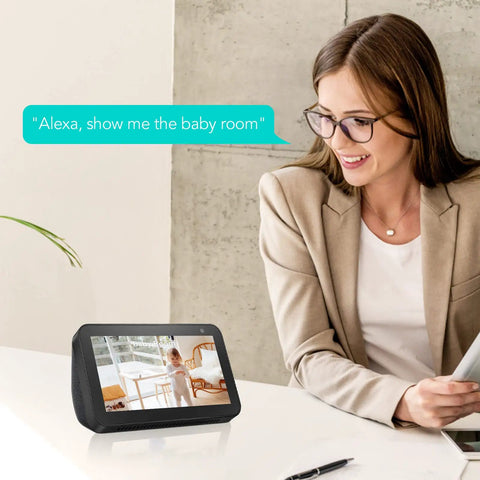 Indoor Smart AI Detection Security Camera For Pets Babies And Home Nanny Cam shown on smart display with woman using Alexa.