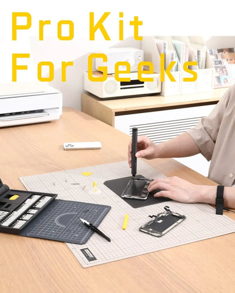 Person using Electric Screwdriver Kit With 64 Magnetic Bits And 12 Precision Tools for phone repair on a desk mat