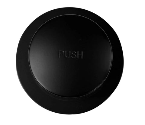 Top view of tip-toe drain plug from Tip Toe Schedule 40 PVC Bath Waste Assembly With One Hole Elbow Matte Black Finish Tub Drain Plug Faceplate And Brass Screws Includes 12 Inch By 4 Inch PVC Tubes For Easy Tub Upgrade.