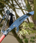 14 Foot Extendable Tree Pruner With RazorTOOTH DualCOMPOUND Action, cutting branch with 13 Inch Curved Saw Blade and foam grip