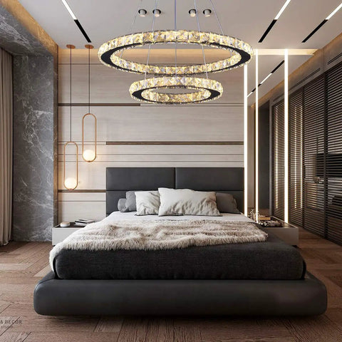 Modern 4-Ring Crystal LED Chandelier With Adjustable Height, K9 Crystal And Stainless Steel, in a stylish bedroom setting