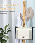 12 Pack Clear Handbag Storage Bags With Zipper And Handles See Through Purse Organizer hanging on rack with clothing.
