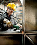 Worker using Beefy Torque 5 Inch Variable Speed Angle Grinder With Electronic Speed Control 2800 To 11000 RPM on metal beam
