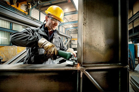 Worker using Beefy Torque 5 Inch Variable Speed Angle Grinder With Electronic Speed Control 2800 To 11000 RPM on metal beam