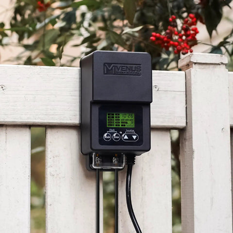 Outdoor Low Voltage Transformer 60W With Timer And Built In Photo Sensor for 12V landscape lighting mounted on a white fence