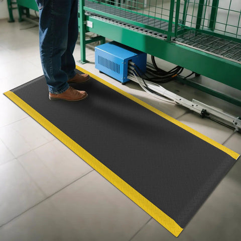 Person standing on Ergonomic Anti Fatigue Mat For Workshop 84 By 35 Inches Cushioned Memory Foam Floor Mat Anti Slip Durable