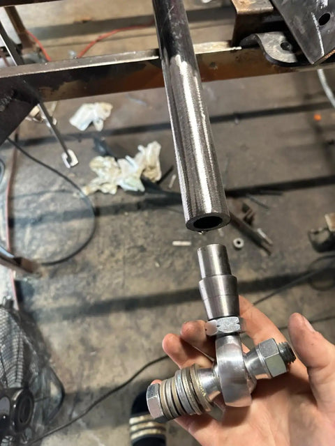 3/8 Inch Heim Joint Rod End Kit With Jam Nut And Bung Chromoly Panhard Kit Right And Left Hand Thread Zinc Coated, held in hand