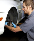 Mechanic working on car wheel assembly with 340 Piece Black Internal Tooth Lock Washers And Push On Clips Fasteners Kit
