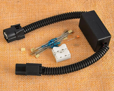 Solid VCM Bypass Harness And Resistor Plug Set For 3.5L V6 Engine, wiring components and connectors on a textured background.
