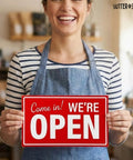 Person holding red Open And Closed Sign For Biz 10 By 6 Inches Double Sided Plastic Sign in a business setting