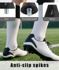 Close-up of nylon plastic soccer cleats, threaded teeth for football boots, anti-slip spikes on grass field.