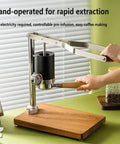 Hand-operated Badass Stainless Steel Manual Lever Espresso Maker With Integrated Pressure Gauge for coffee extraction.