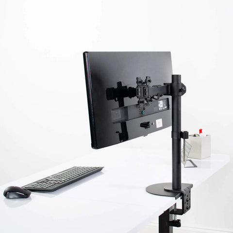 Heavy Duty Steel Reinforcement Bracket And Mount Plate For Glass Or Thin Desks with C Clamp Monitor Arm on a desk.