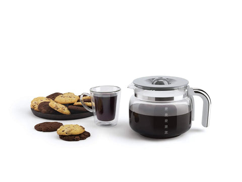 Boost Your Daily Grind With This Smooth Operator Retro Drip Coffee Maker Featuring 10 Cup Glass Carafe with brewed coffee and cookies.