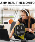 Woman using USB Audio Interface For PC With XLR And 3.5mm Microphone Jack For Home Studio Recording, playing guitar.