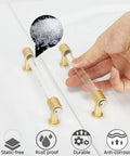 Brushed Brass Cabinet Pulls 25 Pack Six Inch Acrylic Drawer Handles Gold Kitchen Cabinet Hardware for Dresser Cupboards Easy Install Durable Zinc Alloy Crystal Acrylic Design Modern Stylish Look shown with hand and anti-corrosion icons.