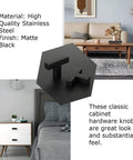 Dead Solid Matte Black T Bar Drawer Pulls And Cabinet Knobs 100 Pack Bulk Hardware For Kitchen Cabinets view of stainless steel knobs on table.