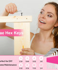 Woman using hex keys from Pink 40 Piece Hand Tool Kit Set With Storage Toolbox For DIY Home Office Garage And Dorm Use