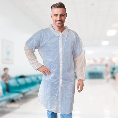 Adult model wearing 10 Pack White Disposable Lab Coats For Adults 3X Large With Elastic Wrists And Loop Closures Knee Length 35 GSM Polypropylene