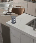 Top Shelf Smooth Pop Up Power Strip For Kitchen Island And Home Office Desk, Heavy Duty Hidden Surge Protector With Overvoltage Safety, Brushed Silver Metal Socket Setup That Slaps on modern kitchen counter, showing recessed design.