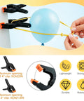 12 Piece Black Balloon Arch Clips Kit For Party, 3 Inch And 4 Inch Nylon, Includes Free Balloons, Flowers, Chains And Dots To Build Epic Backdrops Fast. Black clip holding yellow balloon string, 4-inch opening