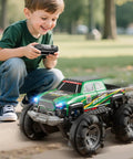 Boy playing with All Terrain Amphibious Remote Control Monster Truck For Kids Ages Six To Twelve With Spray And LED Lights Sick