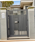 Heavy Duty Waterproof Junction Box For Outdoor Electrical Circuits With UV Resistant Plastic Enclosure seen on a modern gate.