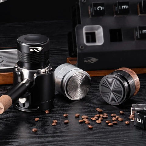 53mm Espresso Tamper For Barista Pros Premium Calibrated Spring Loaded Stainless Steel 100 Percent Stainless Build Fits 54mm Breville Bottomless Portafilter Black Handle Tamp Like A Pro For Even Extraction next to coffee beans and tools