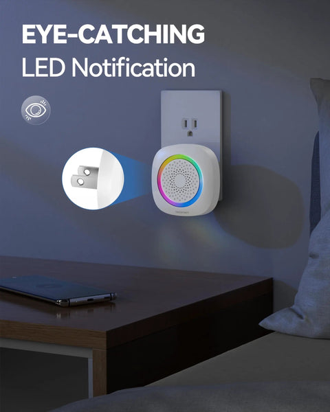 Plug In Wireless Doorbell With RGB Lighting And 1300 Ft Range For Home Office Classroom And Store IP66 Waterproof With 60 Chimes And Five Level Volume And Four And A Half Year Battery Life White, shown plugged into wall outlet with glowing LED