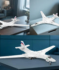 White Swan Fighter Building Block Set 33036 with 1598 pieces, displayed on table, showcasing realistic military bomber model.