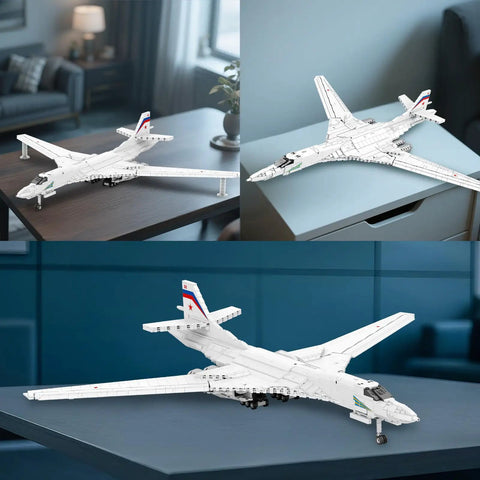 White Swan Fighter Building Block Set 33036 with 1598 pieces, displayed on table, showcasing realistic military bomber model.