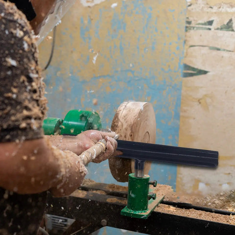 Woodworker using Stainless Steel Lathe Tool Rest With 5 By 8 Inch Post 12 Inch Wood Lathe Turning Accessory for precise control