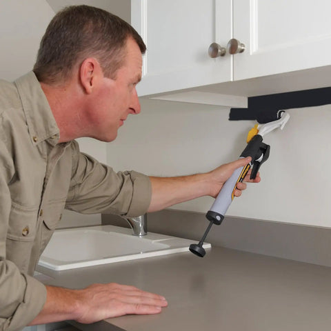Man using Smart Edge 3 Inch Mini Paint Roller Kit With No Tray Design for precise edge trim under kitchen cabinet