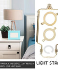 Adjustable Lampshade Harp Holder Kit With Lampshade Bracket And Hardware, pictured next to a lamp on a bedside table.