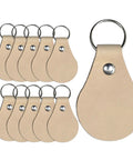 Fresh Veg Tan Leather Key Fobs In A Ten Pack With Pre Assembled Hardware Ready For Stamping Engraving Or Painting With Zero Hassle Straight Out The Box Made Right Here In The Usa For Your Creative Hustle, showing ten leather key fobs with metal hardware.