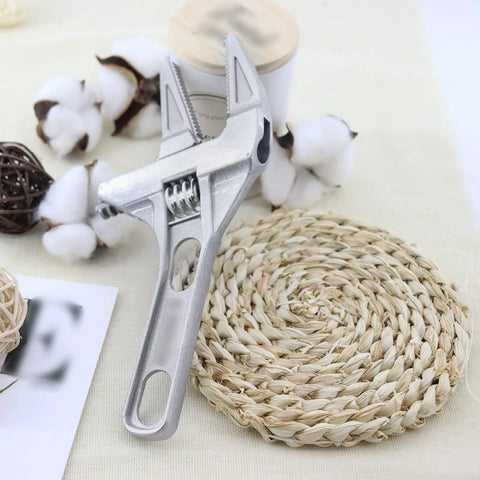 No Hassle Adjustable Short Handle Bath Wrench, Wide Jaw Pipe Spanner And Socket Tool For Bathroom Fixtures, Rock Solid Grip multi function wrench on woven mat.