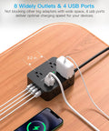 8 Outlet Power Strip With 4 USB Ports 5 Ft Flat Plug Wall Mount ETI Listed Black on wooden desk with devices connected