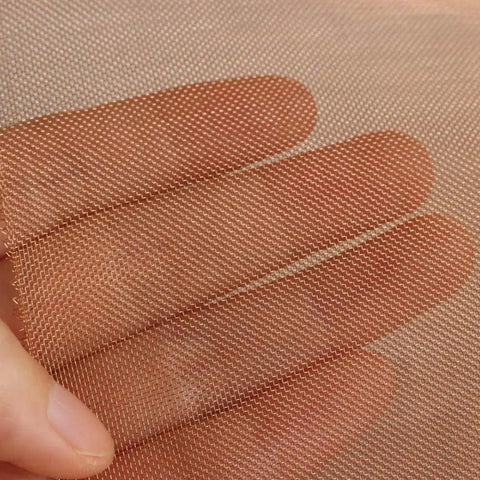 Close-up of Pro Grade Copper Wire Mesh Screen 40 Mesh Dense Filter in hand, showcasing rustproof stainproof copper weave details.