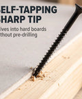 Three Inch Self Tapping Wood Screws Kit With 100 Pieces Number Ten Flat Head Phillips Drive Black Heavy Duty Deck Screws For DIY Projects And Easy Home Repairs Built Tough. Black self-tapping wood screw driving into wood without pre-drilling