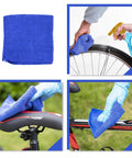 Bike Chain Cleaner Kit With Chain Lubricant And Biodegradable Degreaser, showing blue cleaning towel used on bike frame and wheel