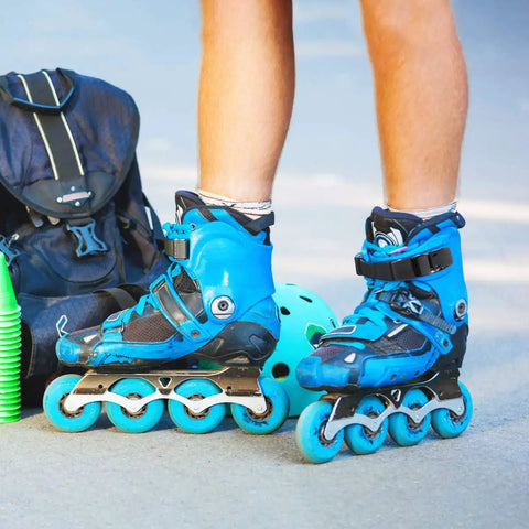 Close-up of person wearing blue inline skates with Must-Have 2 Pack Inline Skate Strap Replacement Kit With Adjustable Buckles.